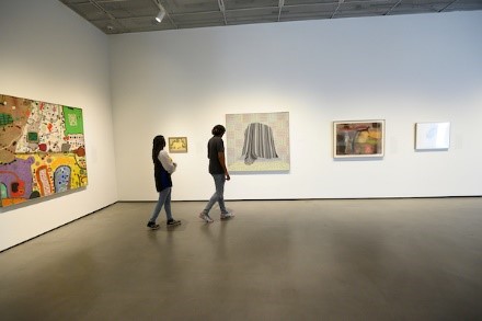 students walking around the museum