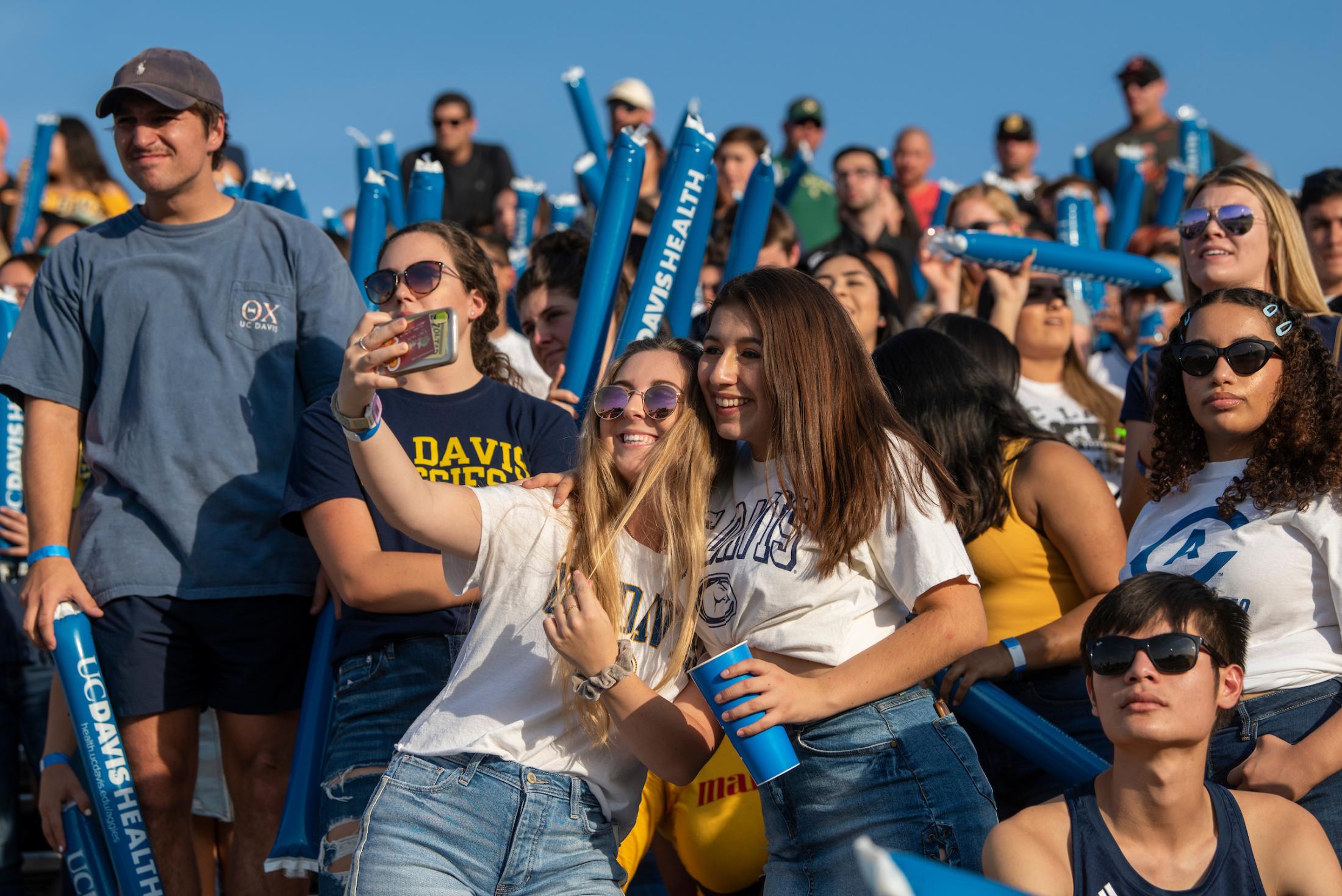 UC Davis students cheering at homecoming