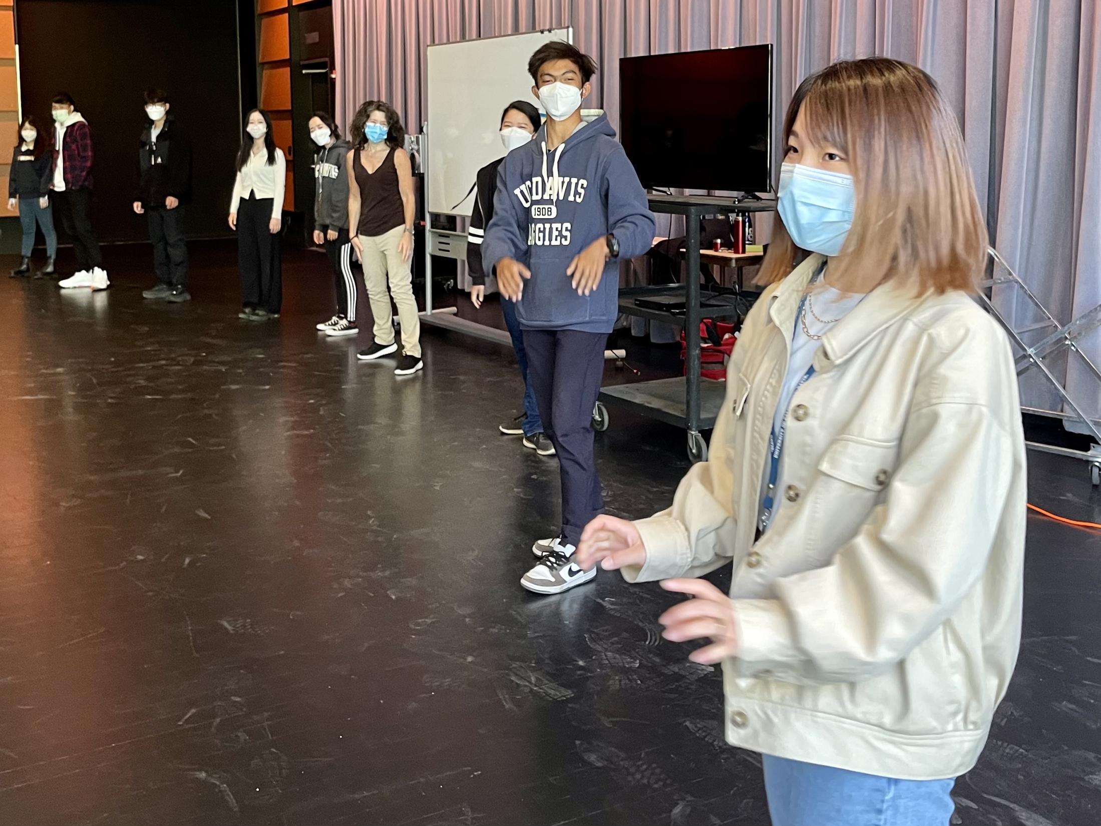 Drama students participate in warm-up activities