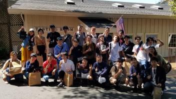Group photo of students in a winery