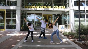 Students posing in front of the International Center