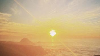 A scenic view of a sunset over the ocean