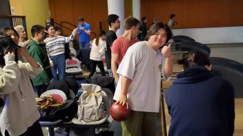 a student poses before bowling at the Memorial Union