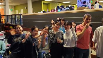 group of students pose in the Game Area of the MU