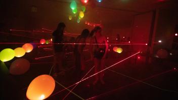 Students go through the laser maze to the music of Mission Impossible during UC Davis Picnic Day.