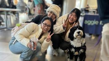 AET students pose for a photo with one of UC Davis' support dogs