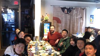 Global Study Program students and staff enjoy sushi at a restaurant