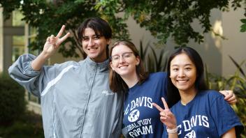 Three UC Davis Global Study Program students pose at the fall 2023 orientation