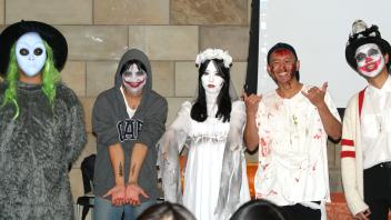 UC Davis International students pose in their Halloween costumes