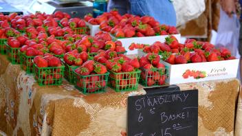 Freshly picked strawberries are displayed at the Davis Farmers Market
