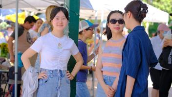 Students from the GREAT Summer Research Program explore the lively atmosphere at the Davis Farmers Market