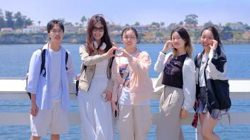 Students from the GREAT Program enjoy the cool and beautiful scenery at Santa Cruz Beach during a trip organized by the program.