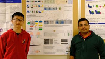 Bolun Zhang stands with Dr. Abhilash Padavannil in front of the research poster on plant mitochondrial complex II in Letts Lab.