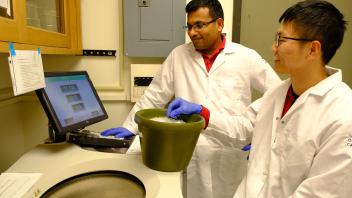 GREAT Program student Bolun Zhang and Dr. Abhilash Padavannil wait for their test sample processing countdown