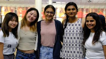 Global Study Program students pose for a photo at the Memorial Union Game Area on campus.