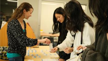 GSP students receive their Aggie Cards and welcome gifts during orientation.