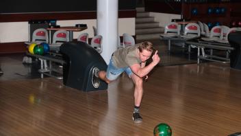 A GSP student participates in a game of bowling