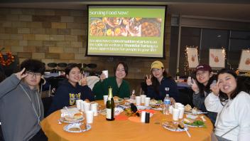 A group of international students pose for a photo during the annual Thanksgiving celebration
