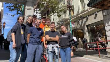 students pose outside the entrance to San Francisco's Chinatown