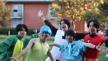 UC Davis international students in costume outside the International Center during the annual Halloween Party.