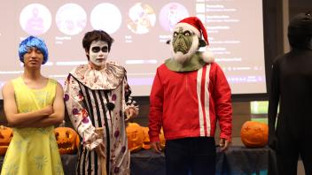 UC Davis international students pose in costume during the costume competition 