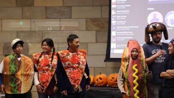 UC Davis international students pose in costume during the costume competition 