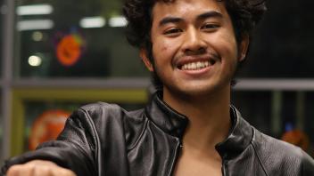 A UC Davis international student in costume poses during the annual Halloween Party.