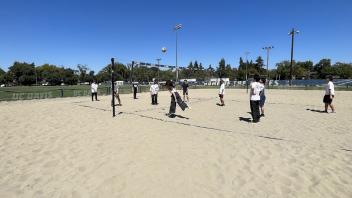 UC Davis international students play a game of beach volleyball