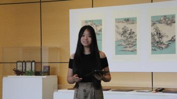 YiFei Li talks about her art during her exhibition