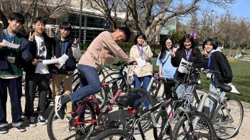 Seikei High School students pose with bikes outside the UC Davis International Center