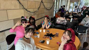 A group of UC Davis international students in costume pose during the annual Halloween Party.