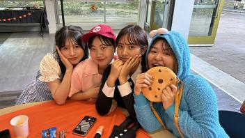A group of UC Davis international students in costume pose during the annual Halloween Party.