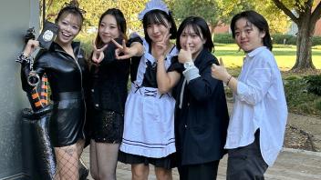 Students in costume outside the International Center during the annual Halloween Party.