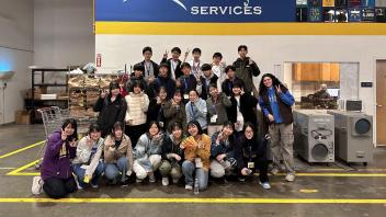 Seikei High School students pose for a photo at the Sacramento Food Bank after volunteering