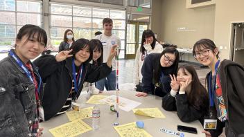 Seikei High School students pose with the structure they built