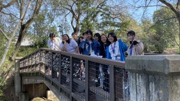 Seikei High School students pose on the UC Davis Arboretum bridge