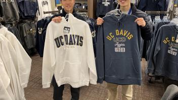 Seikei High School students pose with their UC Davis gear in bookstore
