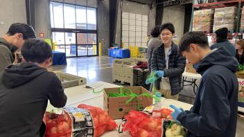 Seikei High School students help package food at the Sacramento Food Bank