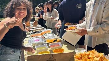 UC Davis international students serve themselves from the Cinco de Mayo taco bar