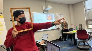 A teacher participates in a classroom activity