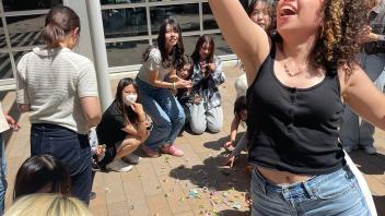 UC Davis international students break a piñata for candy during Cinco de Mayo celebrations 