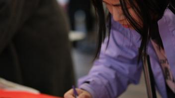 A GSP student practices Chinese calligraphy