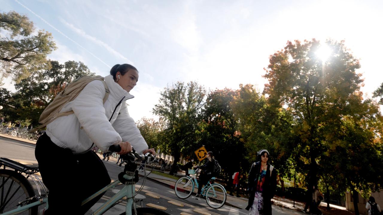 Students ride through the bike circle as they ride across campus