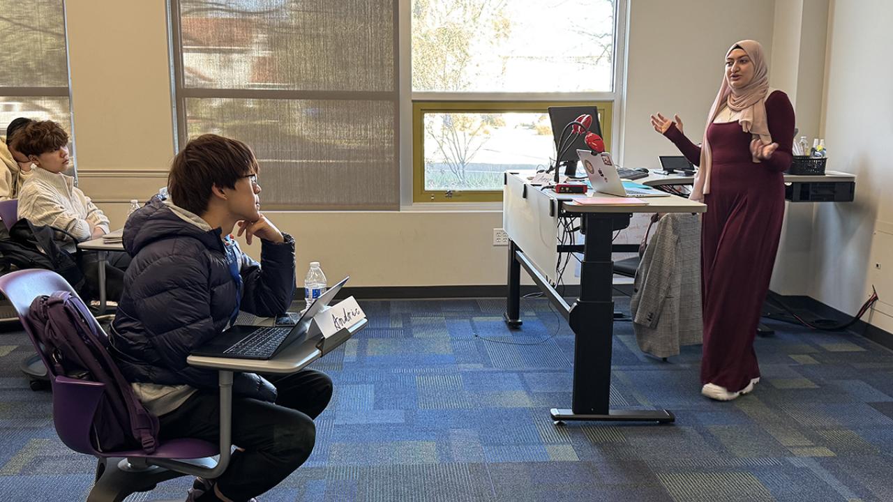 students listen to an instructor's lecture in the classroom