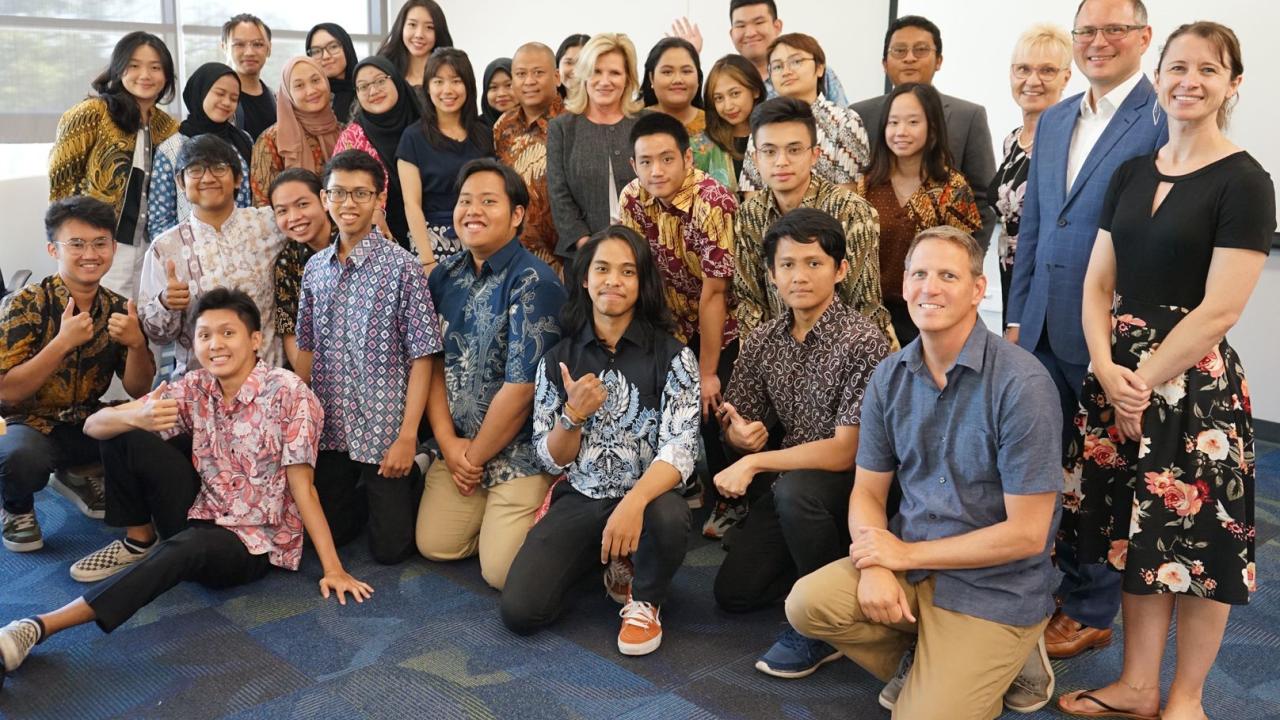 students and program representatives pose for group photo