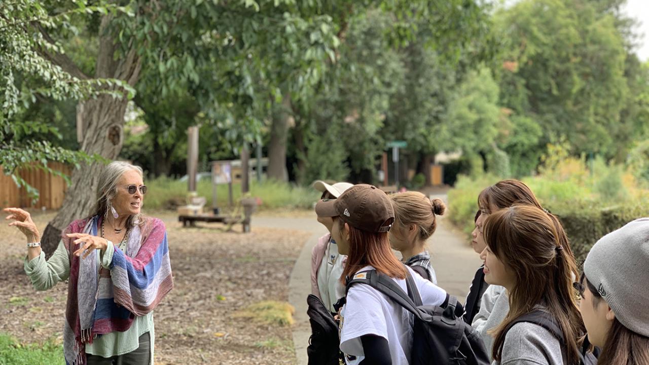 students from Japan visit Village Homes and a resident talks to them about the eco-conscious design