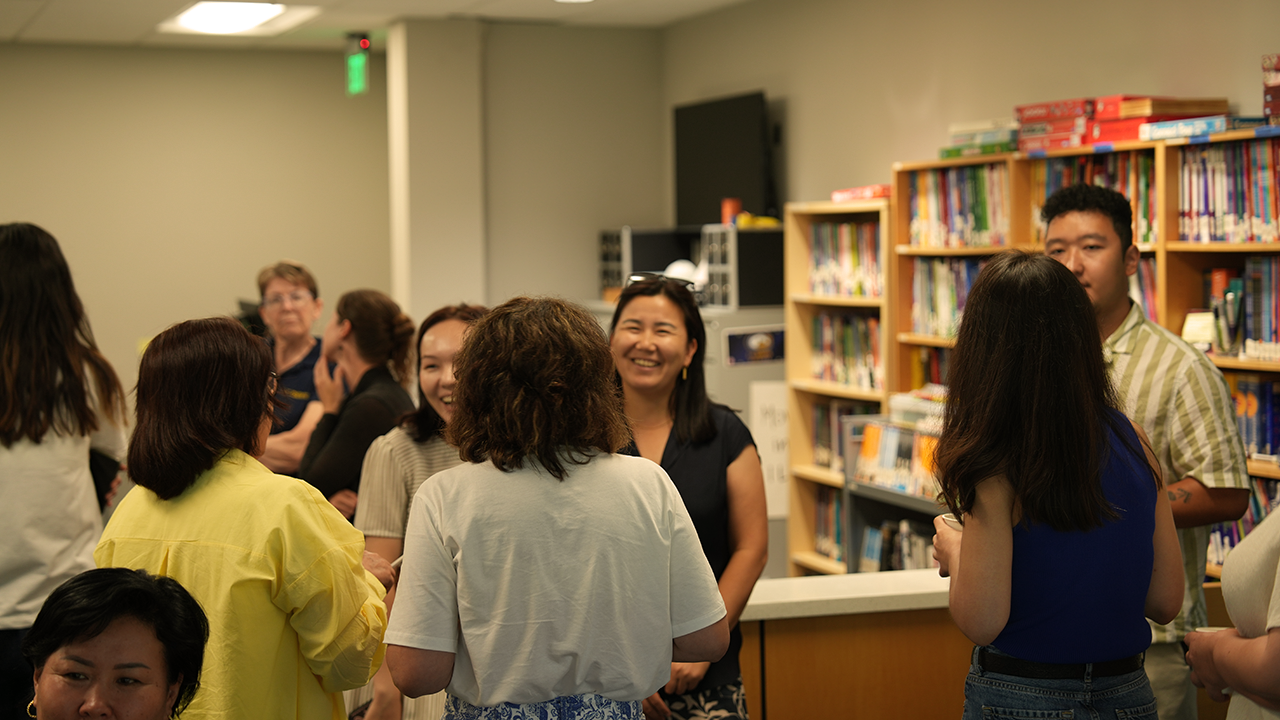 Kazakh scholars gather to socialize during a break at their UC Davis orienation