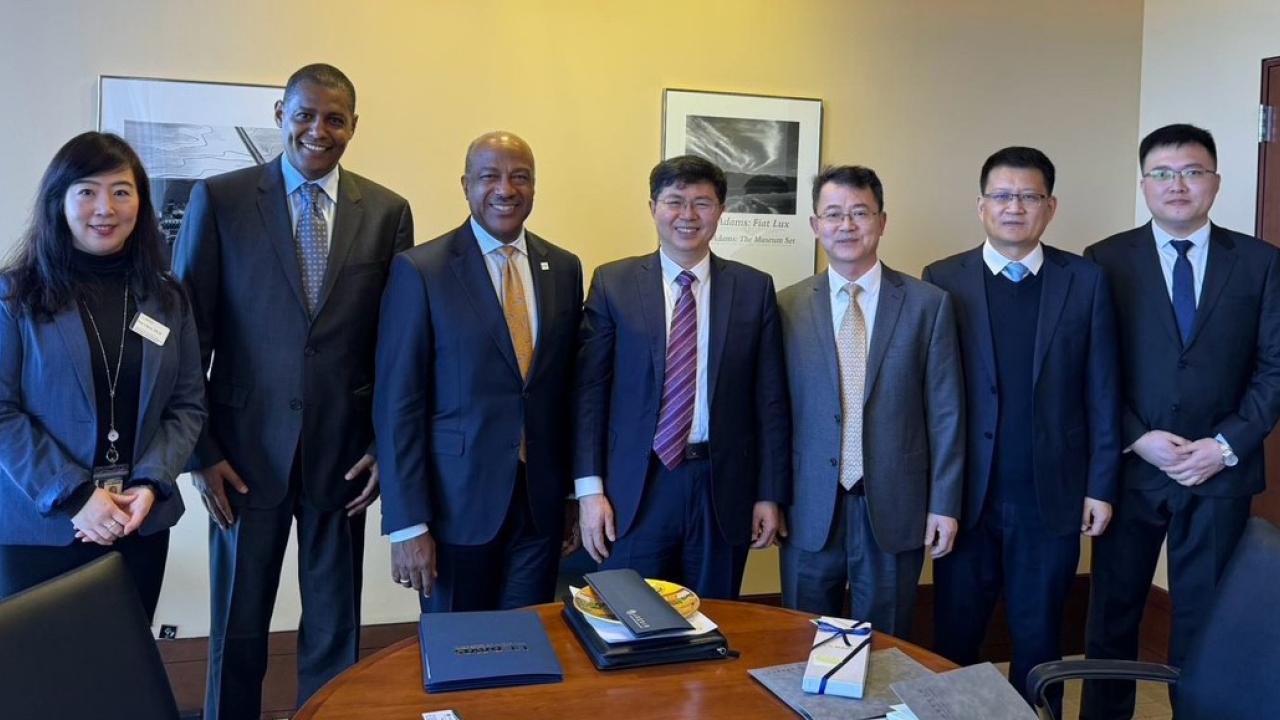 A delegation from Shandong Agriculture University poses with UC Davis Chancellor Gary S May and UC Davis Scholar Ermias Kebreab