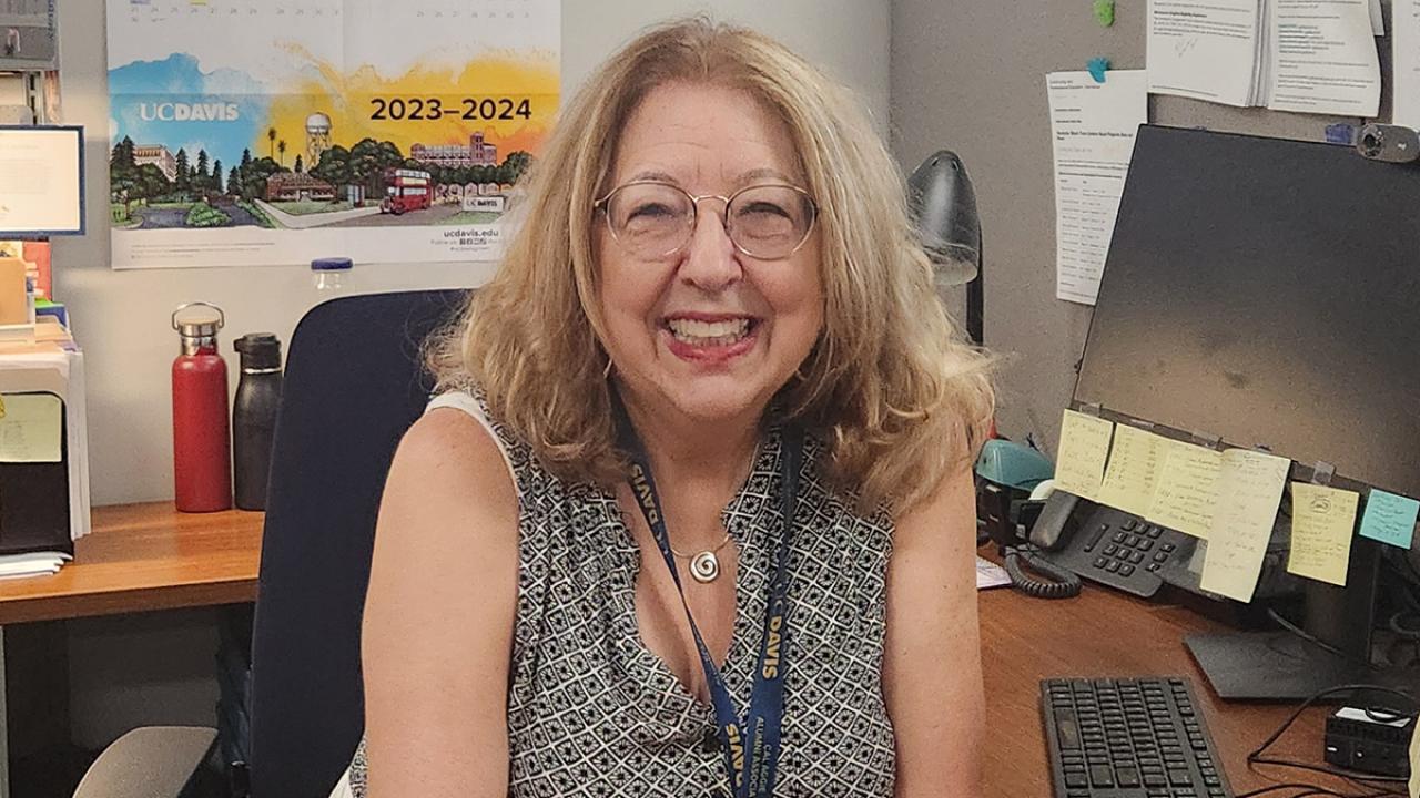 International Program Specialist Paula Khodaverdi sits at her desk