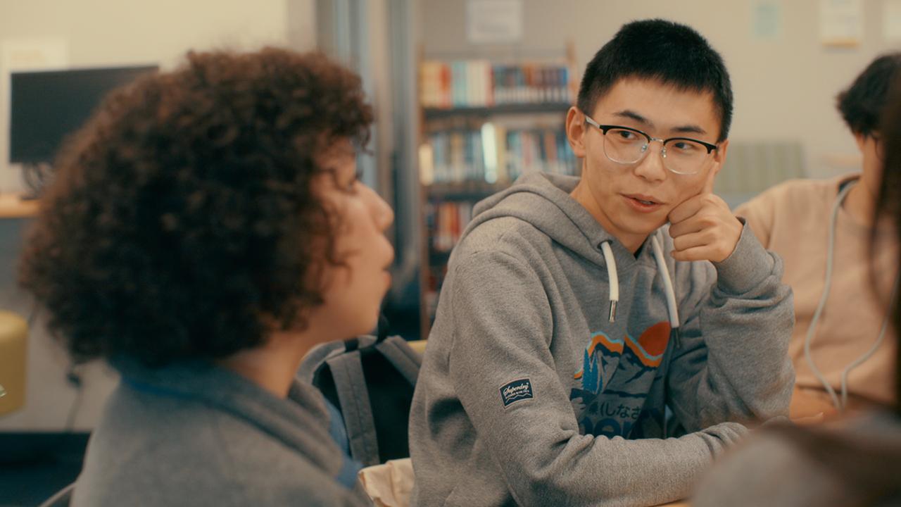 Students having a conversation in the classroom